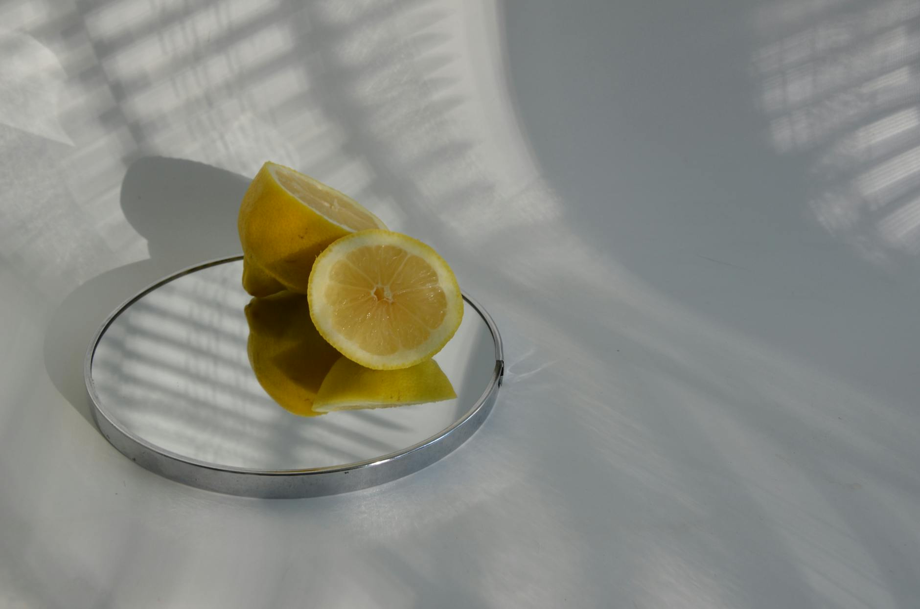 Yellow silicone vibrator surrounded by bananas on bright yellow background